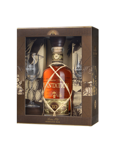 Bouteille de rhum XO dans boîte cadeau, décor tropical avec flûtes et motifs dorés.